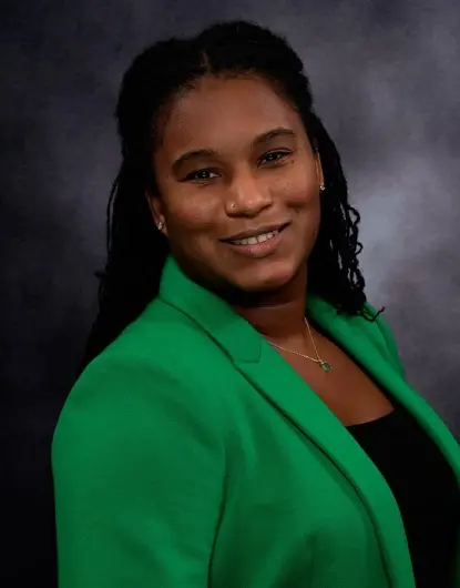 Dr. Shantal, dentist at Silver Spring dental practice, smiles in professional portrait.