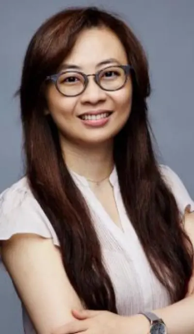 Dr. Joy Chen, dentist at Silver Spring dental practice, smiling in professional headshot.