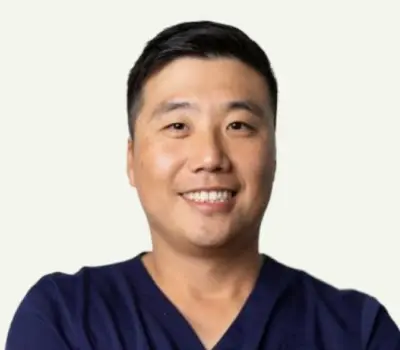 Dr. Park, dentist at Silver Spring dental practice, smiling in professional portrait.