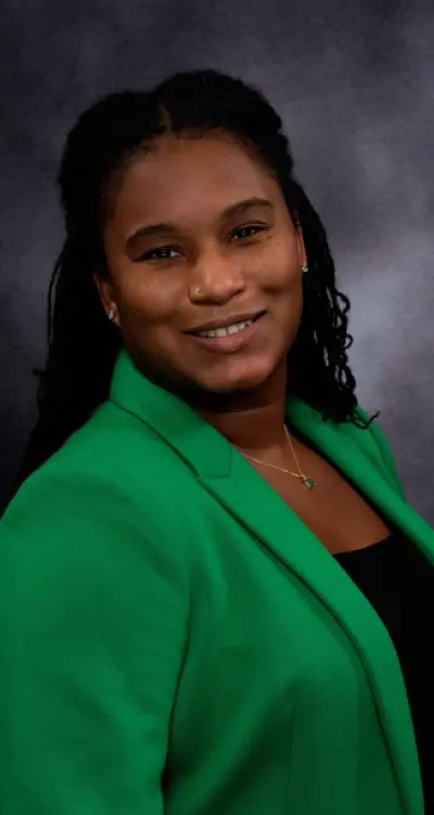 Dr. Shantal, dentist at Silver Spring dental practice, smiling in professional portrait.